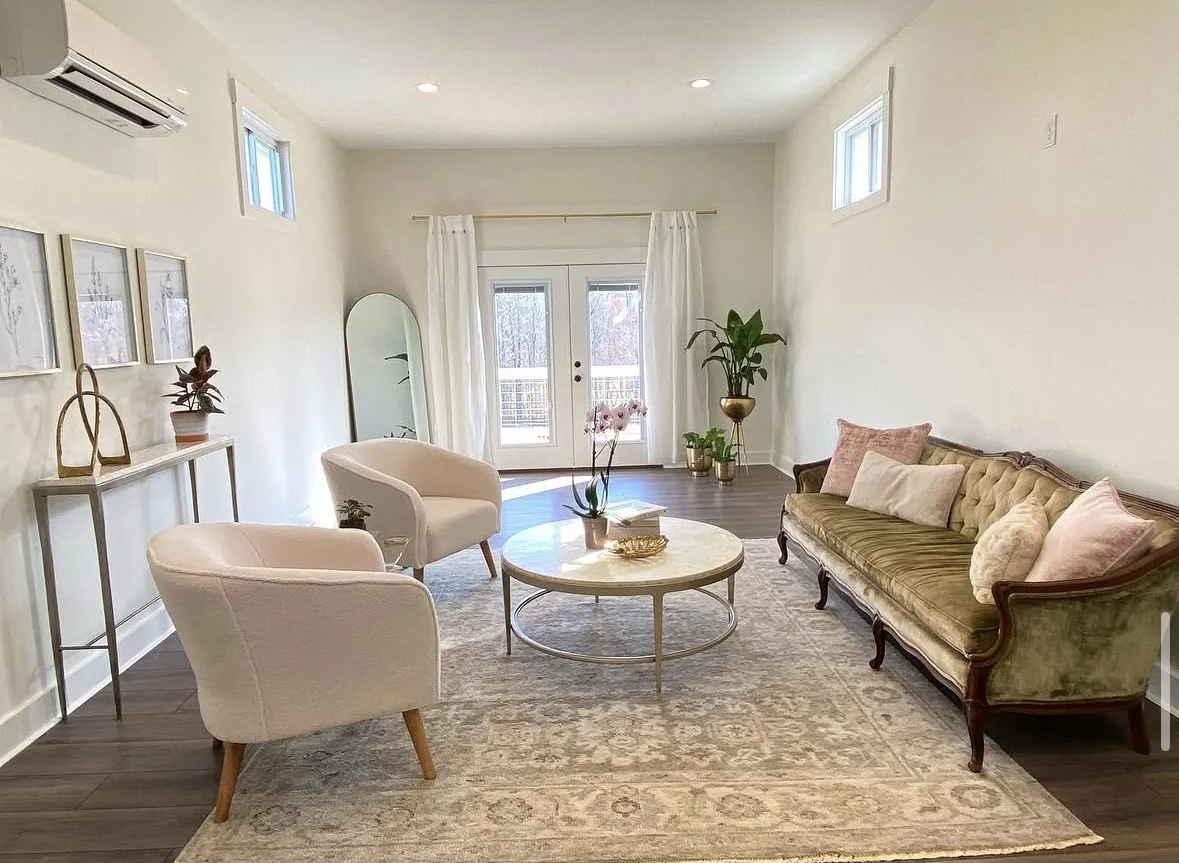 Sofa, armchairs and a marble coffee table in the bright bridal suite