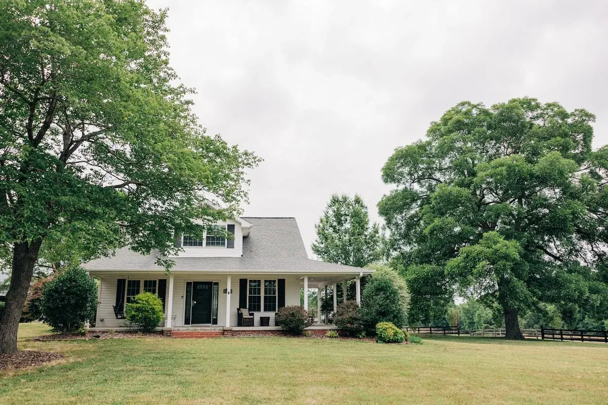 The on-site guest house with a shaded front porch
