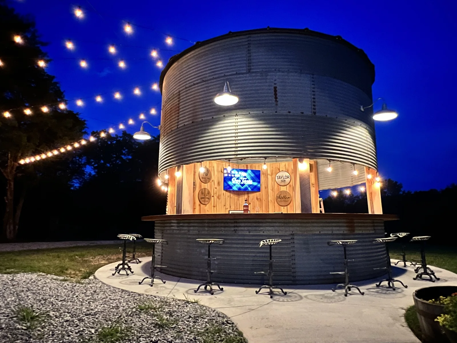 The glowing Silo Bar under evening string lights